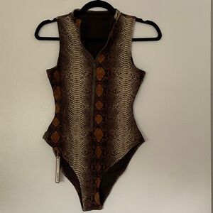 Skims zip front sleeveless one piece swimsuit